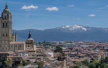 cityscape of madrid with mountain in the background