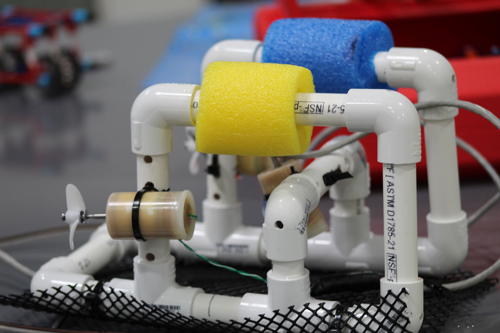 A remotely operated vehicle built with foam rolls, PVC pipes and long cables