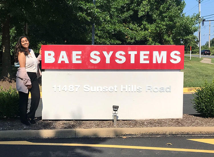Maya standing in front of the BAE Systems sign.