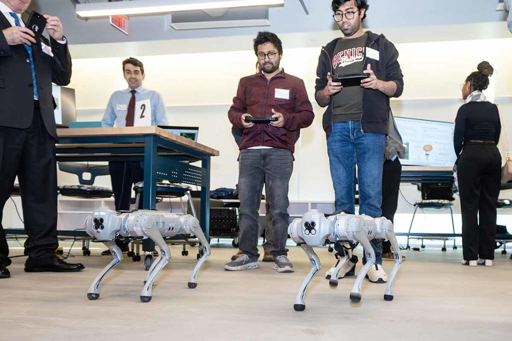Students demonstrat robot quadrapeds