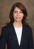Shima Mohebbi wears a black suit and white blouse in her faculty profile for the Department of Systems Engineering and Operations Research at Mason.