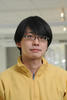 Jyh-Ming Lien wears a yellow shirt and glasses in his faculty profile for the Department of Computer Science at George Mason University