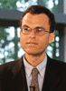 Mason bioengineering professor Giorgio Ascoli wears a black suit, light shirt and tie in his faculty profile